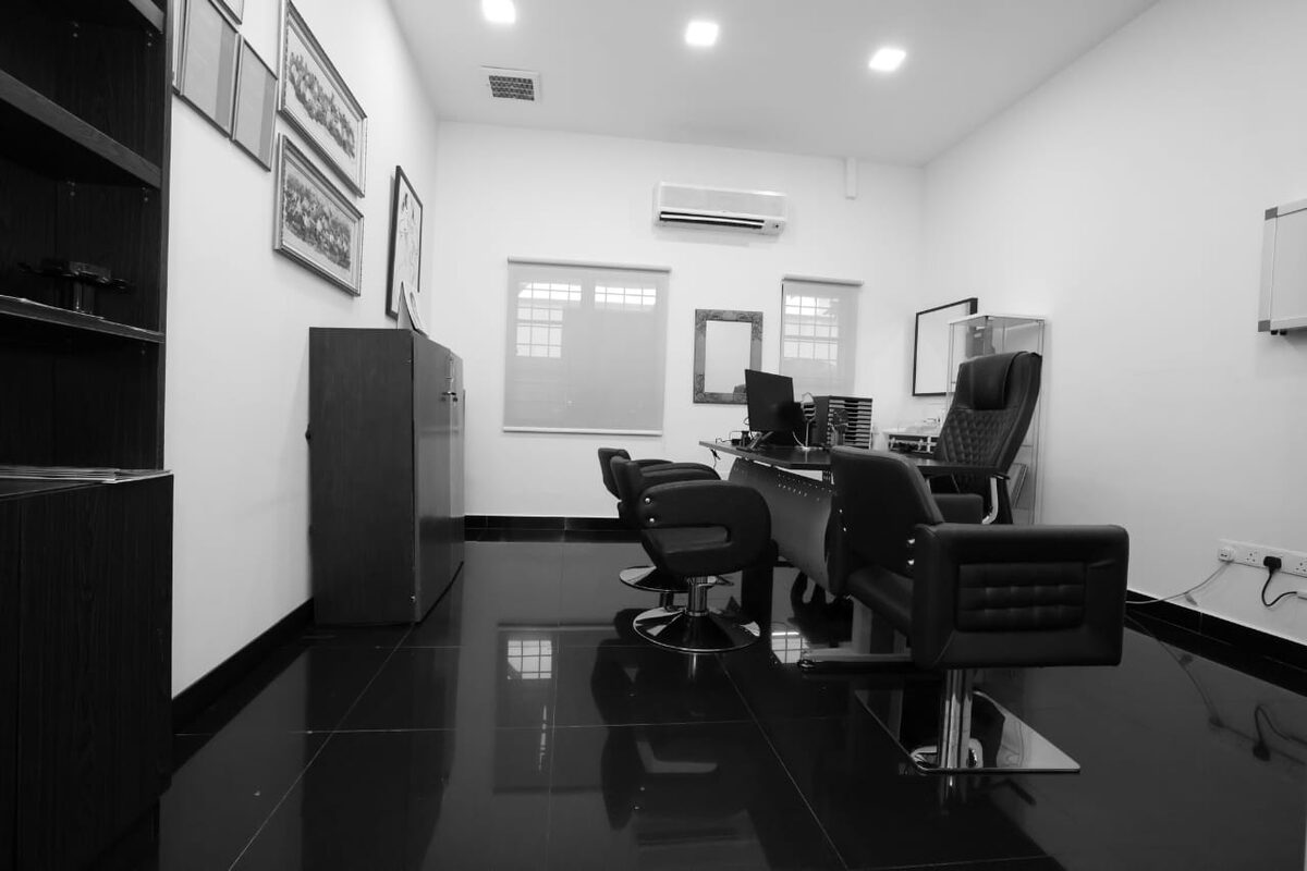 Consultation suite at ARC Clinic with desk and seating